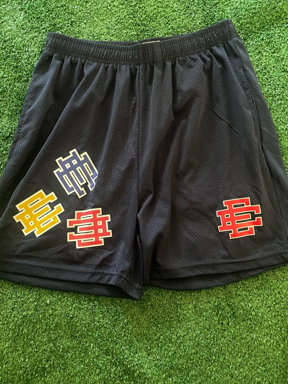 Eric Emanuel Black Mesh Athletic Shorts with Red, Yellow, and Blue Logos
